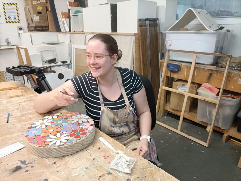 Devon Wogan, creating a mosaic work